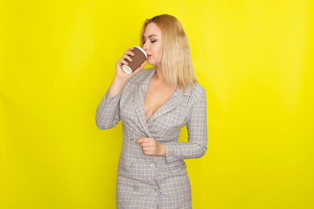 Business blonde woman with cup of coffee