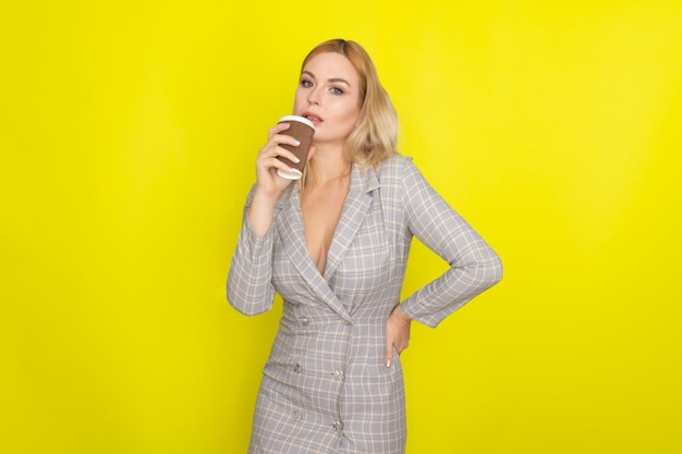 Business blonde woman with cup of coffee