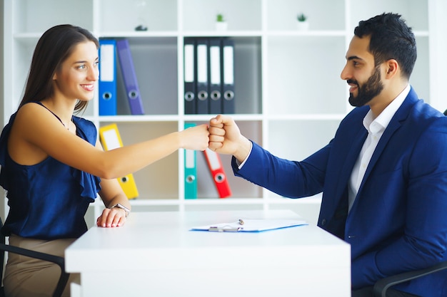 Business. Business Woman and Business Man Talks at the Light Off