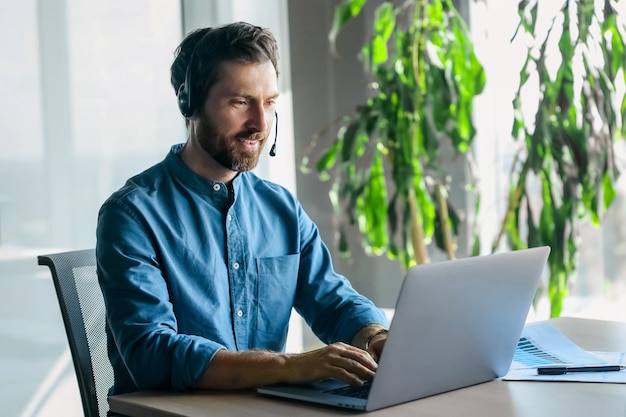 Business call. Young man in blue shirt having a business call