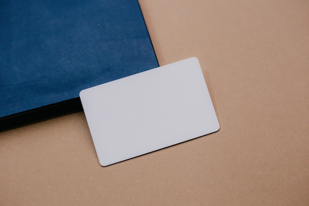 Business cards and blue cardboard box on a cardboard background