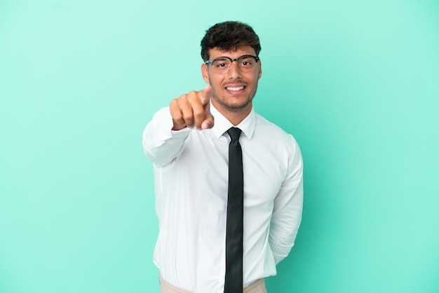 Business caucasian man isolated on blue background points finger at you with a confident expression