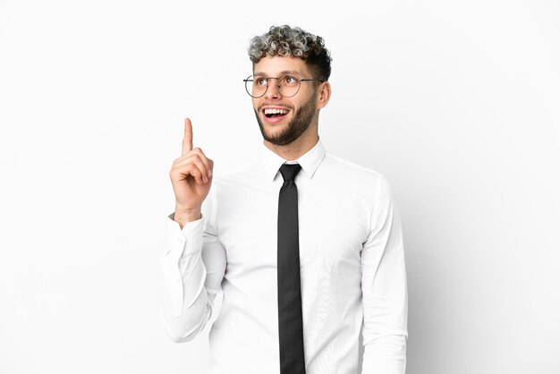 Business caucasian man isolated on white background pointing up and surprised