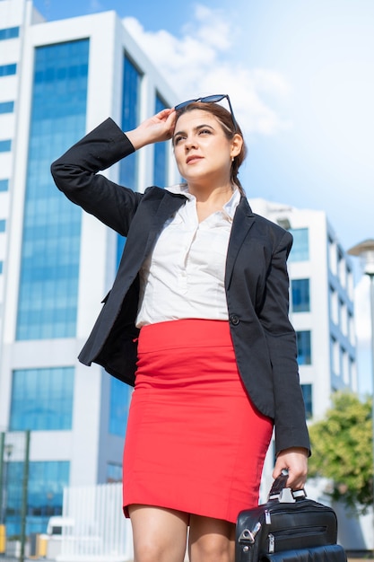 Business caucasianwoman dressed in a suitin her workspace Successful young working woman