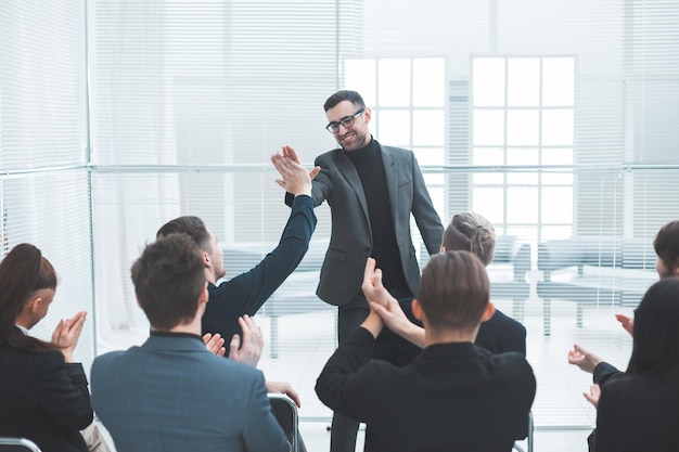 Business colleagues giving each other a high five