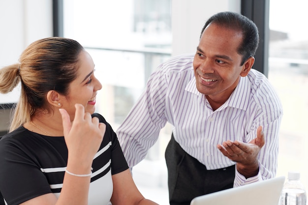 Business colleagues talking at office