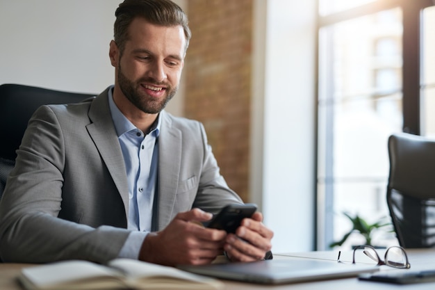 Business company employee smiling at his workplace