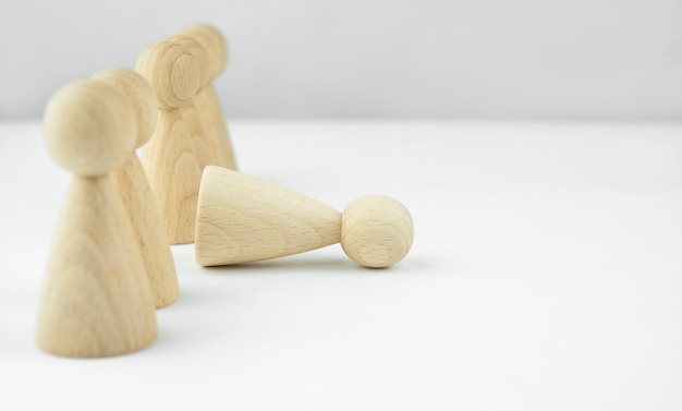 Business concept. Staff recruitment. Headhunting. A lot of staff. Wooden little men on a light table. Copy space.