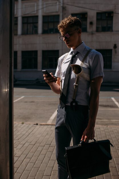 Business contacts. man browsing his phone looking for the needed number. busy lifestyle city life