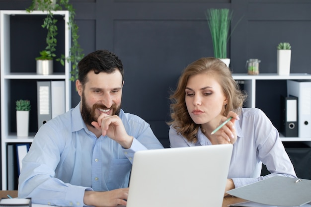 business couple working together on project at modern startup office