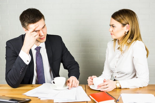 Business couple working together on project at modern startup office.