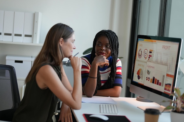 Business discussions Shot of businesswomen brainstorming in an office Two women working at the office