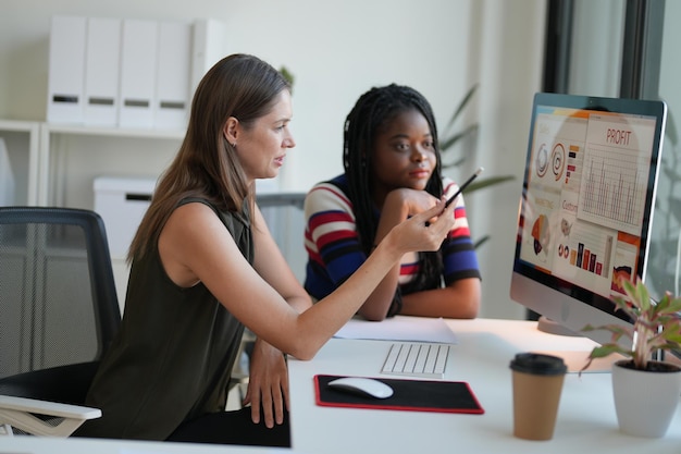 Business discussions Shot of businesswomen brainstorming in an office Two women working