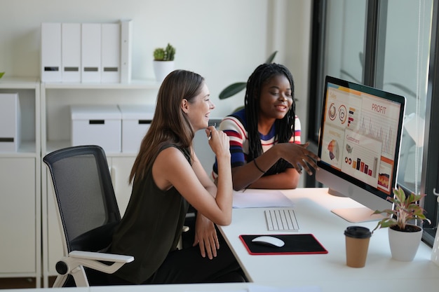 Business discussions Shot of businesswomen brainstorming in an office Two women