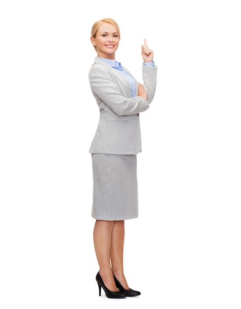 business and education concept - attractive young businesswoman with her finger up