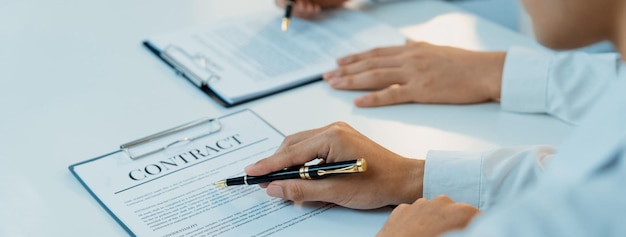 Business executive signing contract agreement document Shrewd