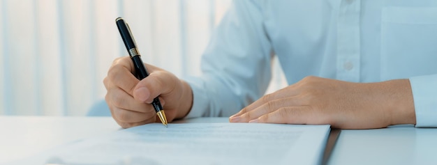 Photo business executive signing contract agreement document shrewd