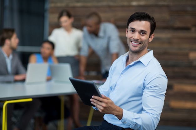 Business executive using digital tablet in office