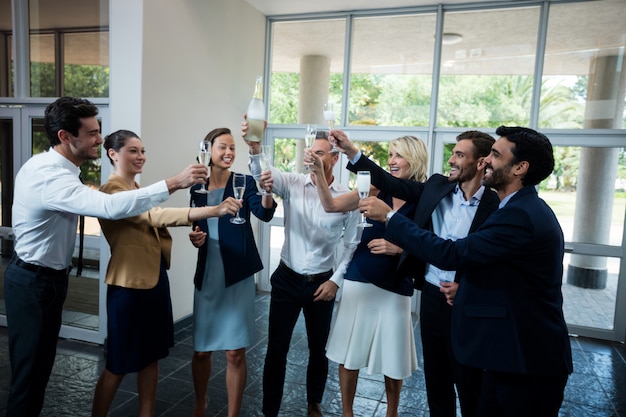 Business executives celebrating at conference center