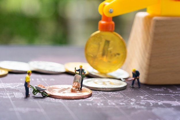 Business and finance, miners working in bitcoin mine.