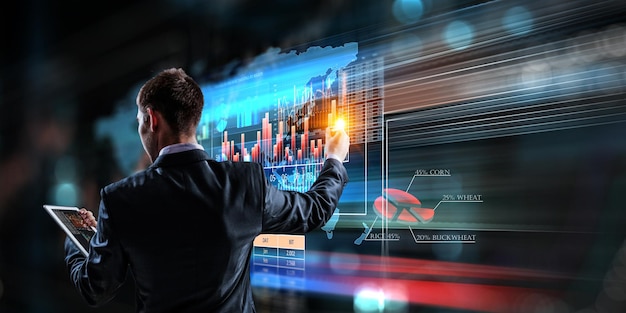 Business graph and trade monitor. Mixed media