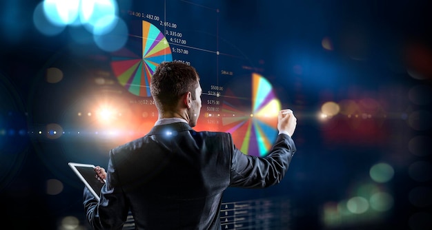 Business graph and trade monitor. Mixed media