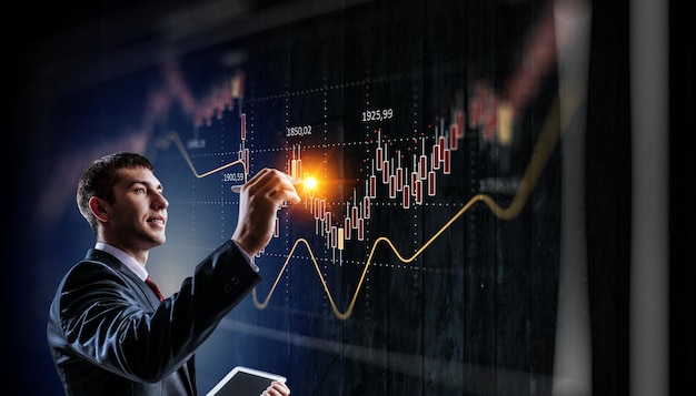 Business graph and trade monitor. Mixed media