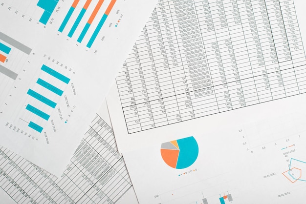 Business graphs and charts financial reports and accounts on the desktop top view