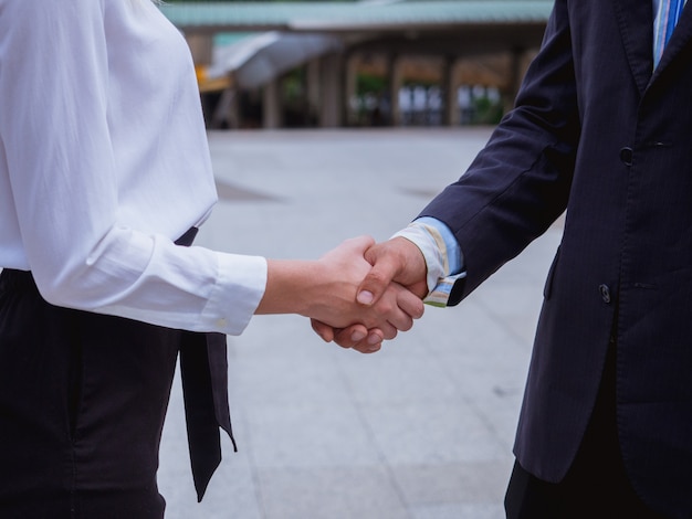 Business hand shake men and women