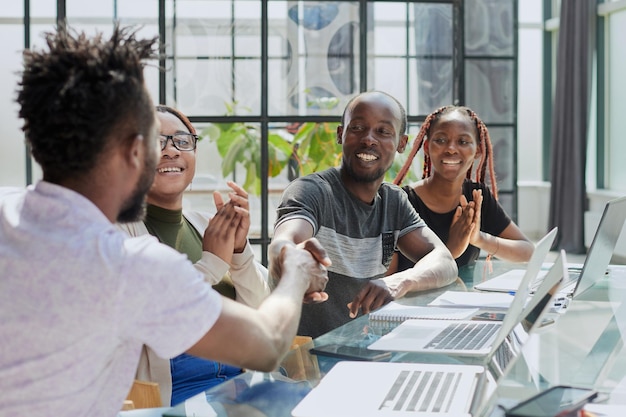 Business handshake in the office african american team