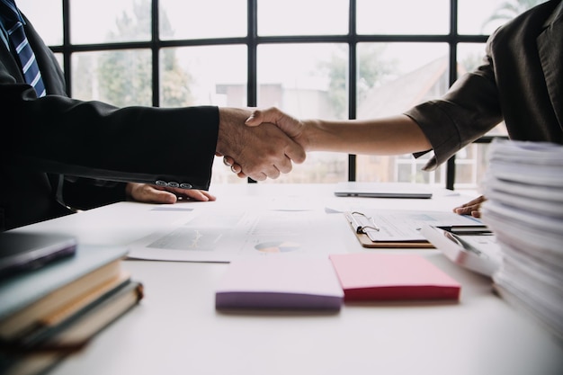 Business handshake for teamwork of business merger and acquisitionsuccessful negotiatehand shaketwo businessman shake hand with partner to celebration partnership and business deal concept