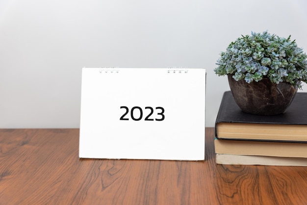 Business idea action concept 2023 calendar book on desk background