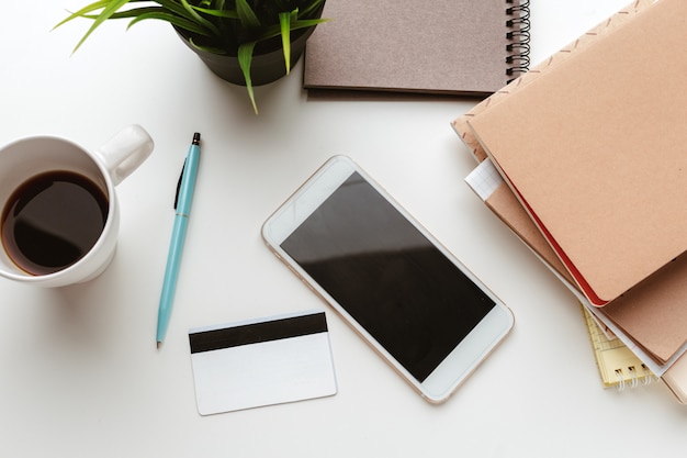 Business Items dropped in creative Disorder on white Table