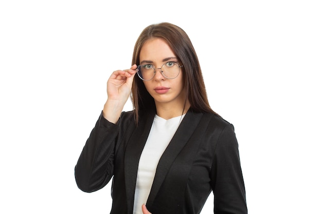 A business lady in a black jacket is holding her glasses On white background