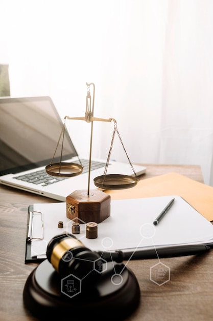 Business and lawyers discussing contract papers with brass scale on desk in office Law legal services advice justice and law concept picture with film grain effect