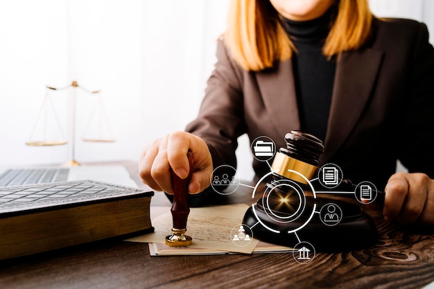 Business and lawyers discussing contract papers with brass scale on desk in office Law legal services advice justice and law concept picture with film grain effect