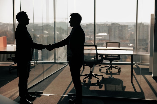 Business male partnership handshake Photo handshaking process Successful deal after meeting