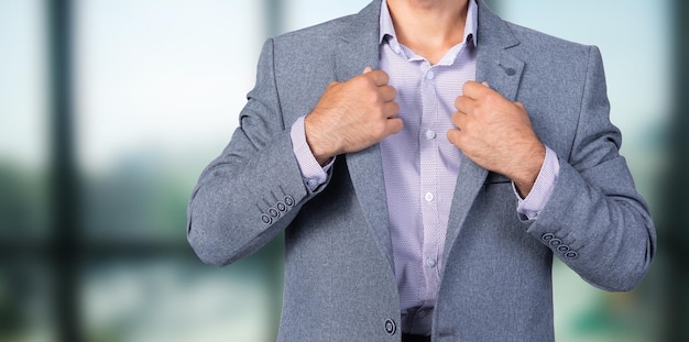 Business man adjusting his suit