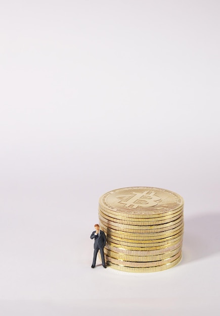 Business man figure standing in front of bitcoin Bitcoin mining concept