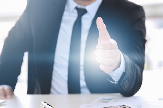 Business man giving his hand for handshake to partner ,partnership concept