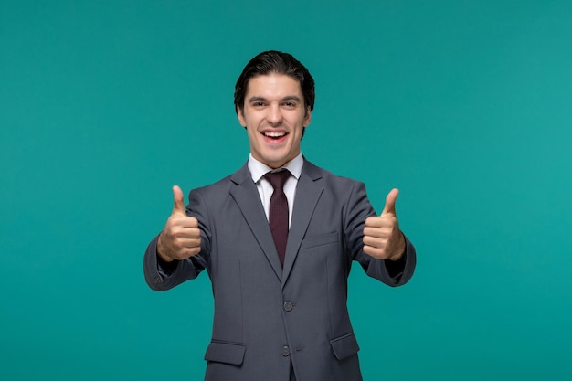 Business man handsome cute guy in grey office suit and tie showing good gesture