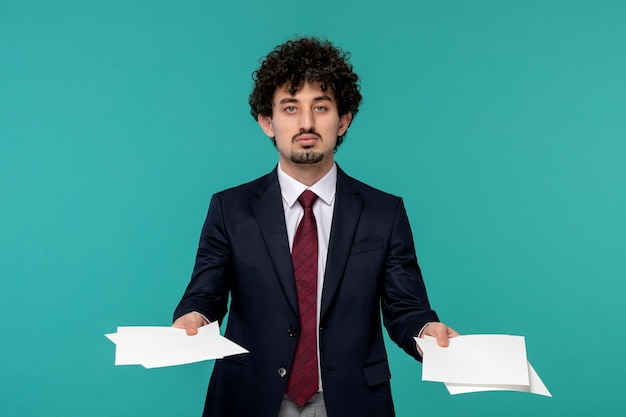 Business man handsome cute young guy in black suit and red tie handling paper sheets