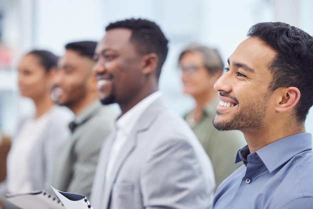 Business man happy group and listening to seminar presentation and salesman at team training workshop Meeting audience and professional at conference with crowd at convention event for speech