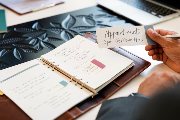 Photo business man holding appointment note concept