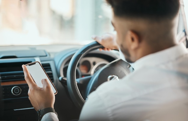 Business man phone map and driving car on mockup screen to search location on mobile application from the back Worker transportation driver or scroll smartphone for direction to travel in journey