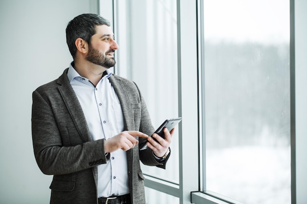 Business man pressing button bitcoin on tablet.