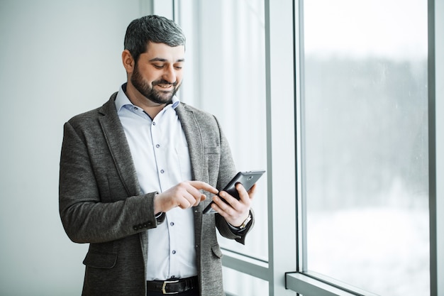 Business man pressing button bitcoin on tablet