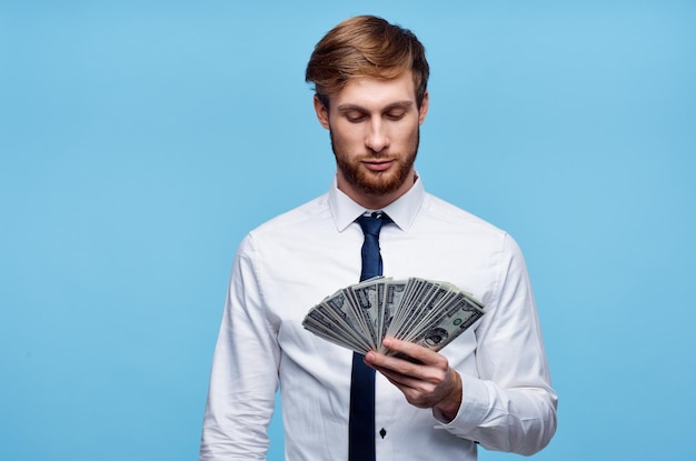 Business man in shirt with tie bundle of money in the hands of the office High quality photo