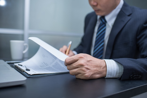 Business man signing a contract  . Close-up photo