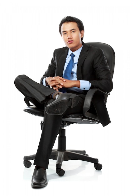 Business man sits on office chair